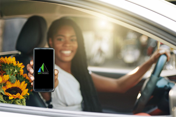 APT rides driver happy, smiling and showing app